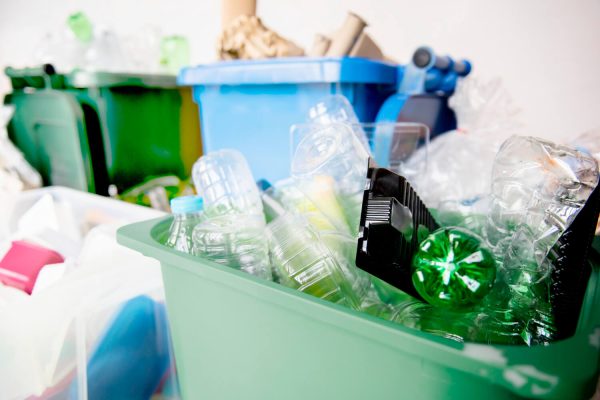 used-plastic-bottles-recycling-bins-earth-day-campaign-op